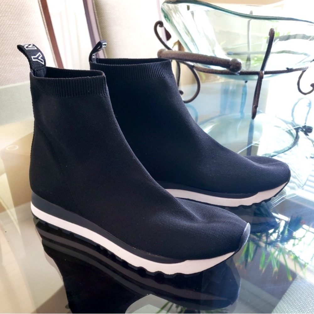 Ribbed collars and sock-savvy style sleek sporty look in the sneakers by DKNY